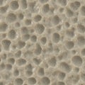 A textured surface resembling a porous material with irregular, rounded indentations. Royalty Free Stock Photo