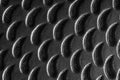 Textured surface showcasing a close-up of a black metallic pattern used in industrial applications Royalty Free Stock Photo
