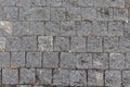 The textured surface of the sidewalk, square smooth gray stones, paving pavement. Backdrop texture background Royalty Free Stock Photo