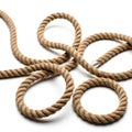 Textured twisted rope coiled and looped on a white surface isolated on white background Royalty Free Stock Photo