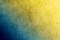 A textured vintage stucco background with a dark blue to golden yellow gradient Royalty Free Stock Photo