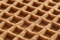 Textured waffle pattern, close-up view, warm brown tones, soft surface Royalty Free Stock Photo
