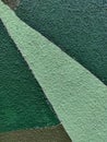 Textured wall painted in geometric green shades Royalty Free Stock Photo