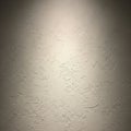 Textured wall surface with a light cream color. The wall fea Royalty Free Stock Photo