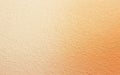 Textured wall with warm gradient hues in soft beige and orange tones, perfect for backgrounds and design elements Royalty Free Stock Photo