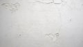 Textured White Plaster Wall with Cracks and Chips white wall Royalty Free Stock Photo