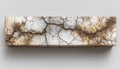 Textured White Rectangular Object with Cracked Surface and Gold Flecks on Gray Background Royalty Free Stock Photo