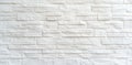 A textured white stone wall with a modern design perfect for backgrounds and interior decor projects Royalty Free Stock Photo