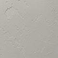 A textured white surface with subtle irregularities and small cracks. It appears to be Royalty Free Stock Photo