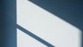 Textured White Wall with Diagonal Shadow and Light Patterns Creating a Minimalist Background Royalty Free Stock Photo