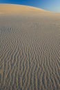 Textured windblown sand dune blue sky australia