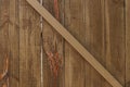 Textured wooden paling fence with cross strut background Royalty Free Stock Photo