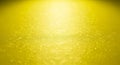 Textured Yellow Surface with Bright Light and Subtle Bubbles abstract background Royalty Free Stock Photo