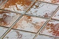 Textures and Colorful Brown and Golden Reflections on Tiles Royalty Free Stock Photo