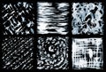 Textures with lattices, stripes, swirls, spirals. Set of abstract watercolor monochrome textures on a black background.