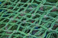 A close up of fishing nets drying on the edge of a Cornish fishing harbour