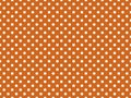 texturised white color polka dots over chocolate brown backgroun