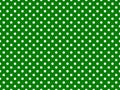 texturised white color polka dots over green background