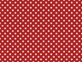 texturised white color polka dots over firebrick red background