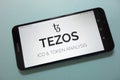 Tezos XTZ cryptocurrency logo displayed on smartphone