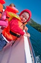 TFloating toddler boy in a boat Royalty Free Stock Photo