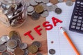 `TFSA` Tax Free Savings Account signs with coins in the background Royalty Free Stock Photo