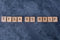 `TFSA vs RRSP` spelled out in wooden letter tiles