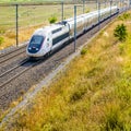 A TGV Duplex high-speed train in the french countryside Royalty Free Stock Photo