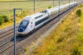 A TGV Duplex high-speed train in the french countryside Royalty Free Stock Photo