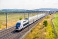 A TGV Duplex high-speed train in the french countryside Royalty Free Stock Photo