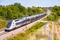 A TGV Duplex inOui high-speed train in the countryside Royalty Free Stock Photo