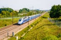 A TGV high speed train driving in the french countryside Royalty Free Stock Photo