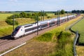 A TGV inOui high speed train in the countryside Royalty Free Stock Photo