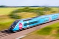 A TGV Ouigo high speed train with motion blur Royalty Free Stock Photo