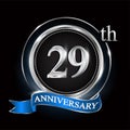 29th anniversary logo with silver ring and blue ribbon