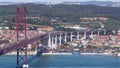 25th of April Suspension Bridge over the Tagus river, connecting Almada and Lisbon in Portugal timelapse Royalty Free Stock Photo