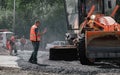 30th of August, Russia, Tomsk, road workers repair roadbed