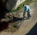 8th August 2020. Uttarakhand, India. A construction worker operating hammer drill or jackhammer on a road in India for repair