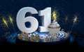 61th birthday or anniversary cupcake with big white number with yellow streamers on blue table with dark background full of sparks