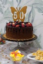 50th birthday cake with chocolate, strawberries and blueberries Royalty Free Stock Photo