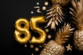 85th birthday celebration background with gold balloons and golden pineapples
