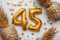 45th birthday celebration card with gold foil balloons and golden pineapples