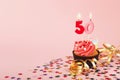 50th birthday cupcake with candle and sprinkles Royalty Free Stock Photo