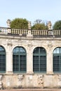 18th century baroque Zwinger Palace, view of Long gallery with statues at the top, Dresden, Germany