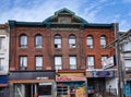 19th century building with ornate roof cornice