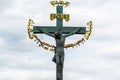 17th Century Crucifixion statue with Hebrew lettering in Charles Bridge Prague, Czech Republic. Prague eldership forced oppressed