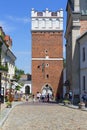 14th century gothic entrance Opatowska Gate, view of Opatowska Street, Sandomierz, Poland Royalty Free Stock Photo