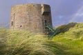 The 19th century round Martello tower fort built in the sand dunes at Magilligan Point near Limavady in County Derry in Northern I Royalty Free Stock Photo
