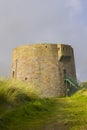 The 19th century round Martello tower fort built in the sand dunes at Magilligan Point near Limavady in County Derry in Northern I Royalty Free Stock Photo