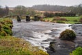 13th century stone clapper bridge built over the East Dart River at Postbridge, Dartmoor National Park, Devon, UK